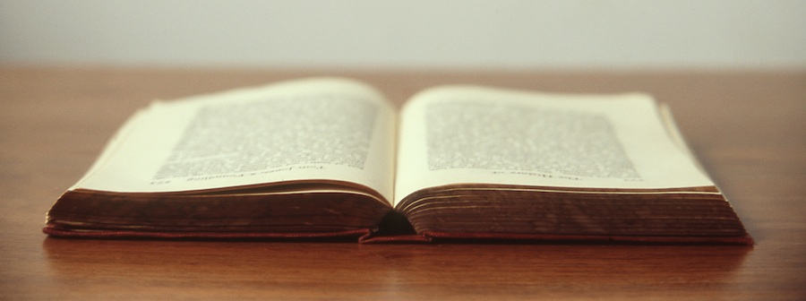 Book lying open on desk